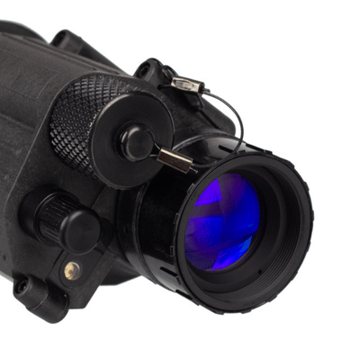 Close-up of night vision monocular lens with blue tint, highlighting detailed optics for improved visibility