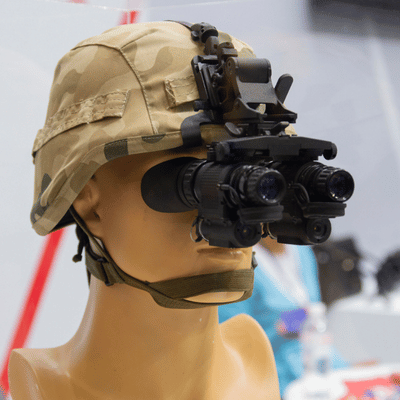 Mannequin wears military helmet with mounted night-vision flight goggles, displaying modern aviation protective equipment today