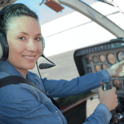Pilot wearing headset inside cockpit, preparing controls and briefing for helicopter nvg training flight