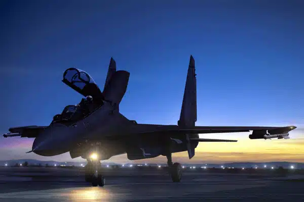 Fighter jet sits on runway at dusk with lights on army nvg training today outdoors